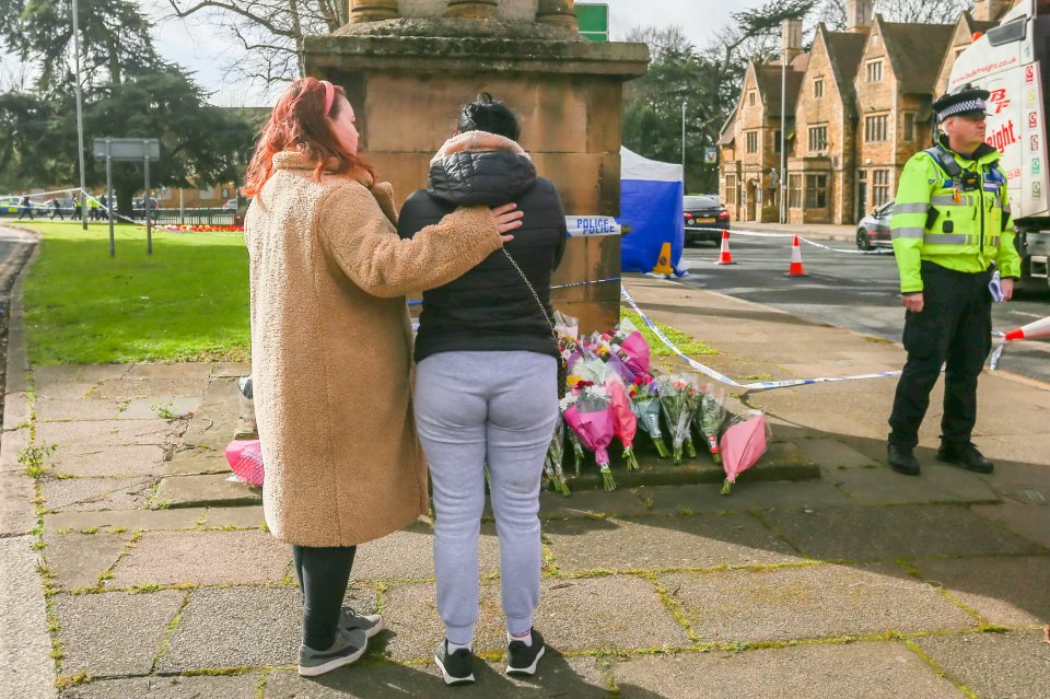 Mourners visiting the scene today