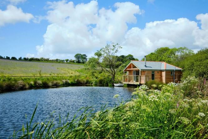 The Boat House overlooks a lake in Cornwall