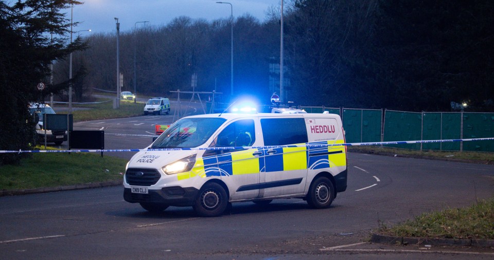 Police vehicles close off the A48 between Cardiff and Newport after the car of five missing people was found last night