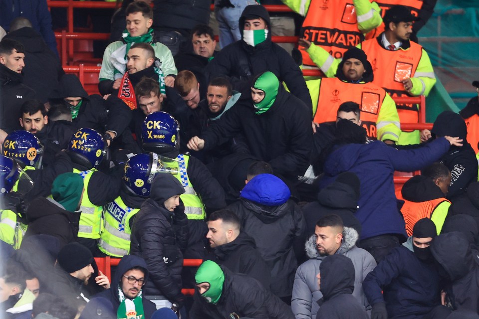 Real Betis fans clashed with riot police after their defeat at Man Utd