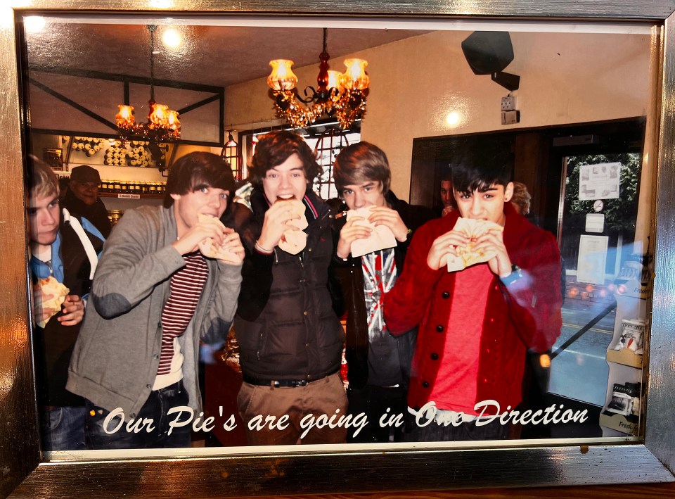 The picture of One Direction hanging up in the bakery