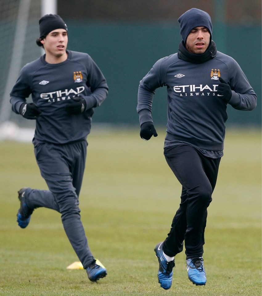 Assulin, training with Carlos Tevez, was on the books with Manchester City