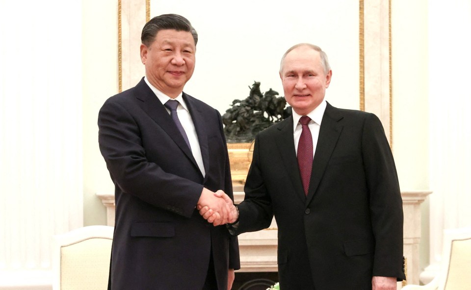 The two despots warmly shook hands in the Kremlin