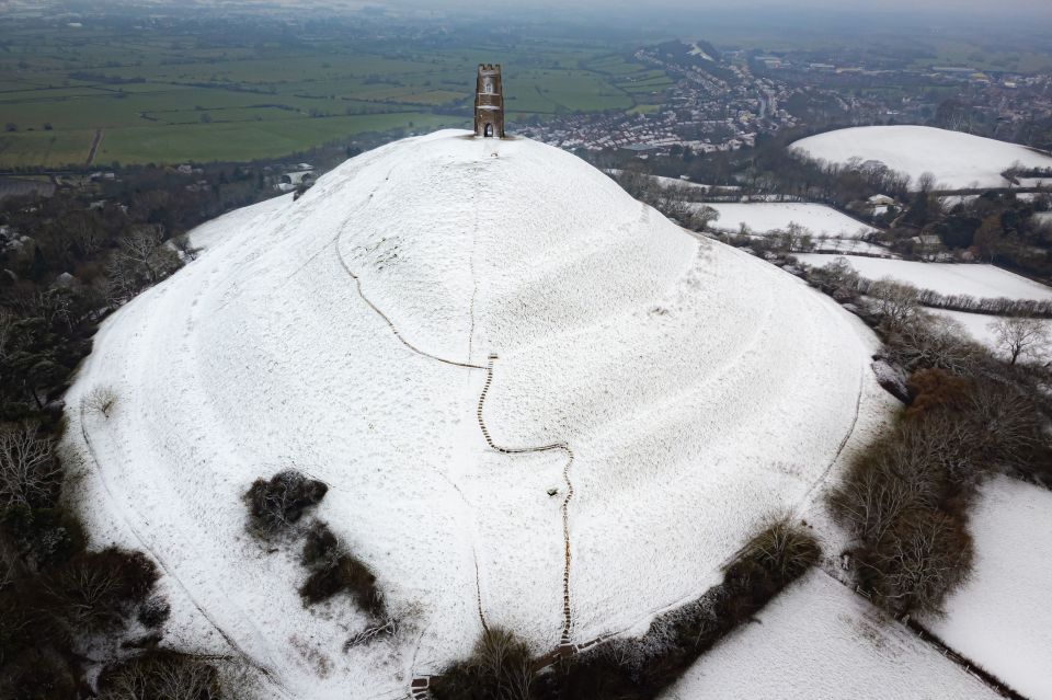 Snow settles on Glastonbury Tor, Somerset