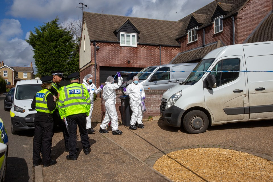 Forensics officers attend the scene of one shooting in Sutton where Gary Dunmore was killed