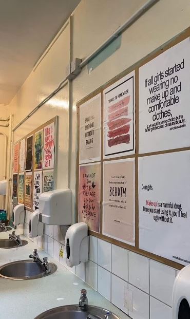 Six posters have been plastered on the wall