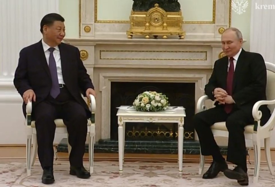 Vladimir Putin’s feet twitched as he squirmed opposite Xi Jinping