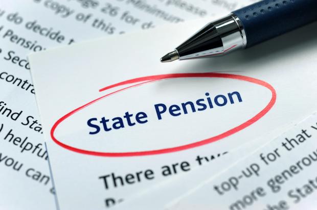 a pen rests on a piece of paper that says state pension