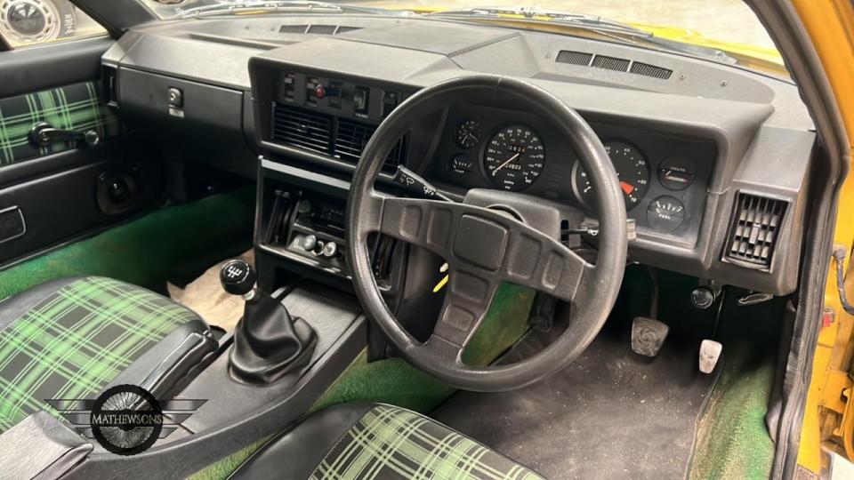 The interior shows some signs of wear, but is in good overall condition