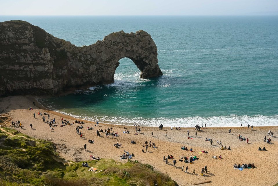 The stark change in the weather comes after people were able to enjoy a fine day on the beach at Durdle Door in Dorset on Easter Sunday