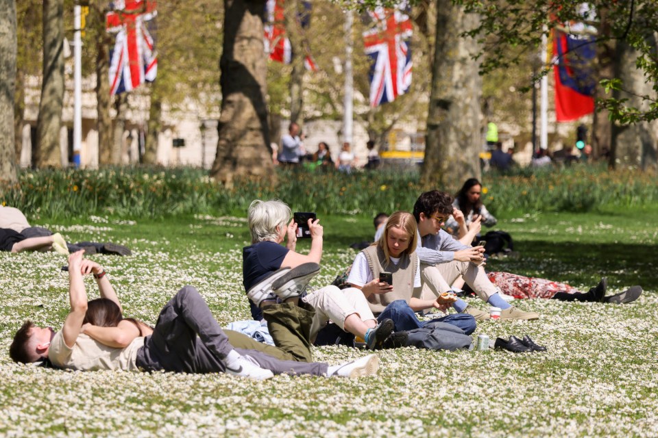 People made the most of the sunny weather in St James's Park, central London today