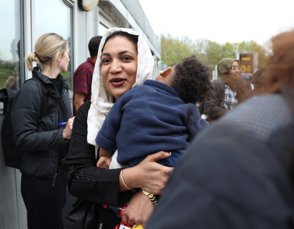 People evacuated from Sudan arrive on a flight from Cyprus