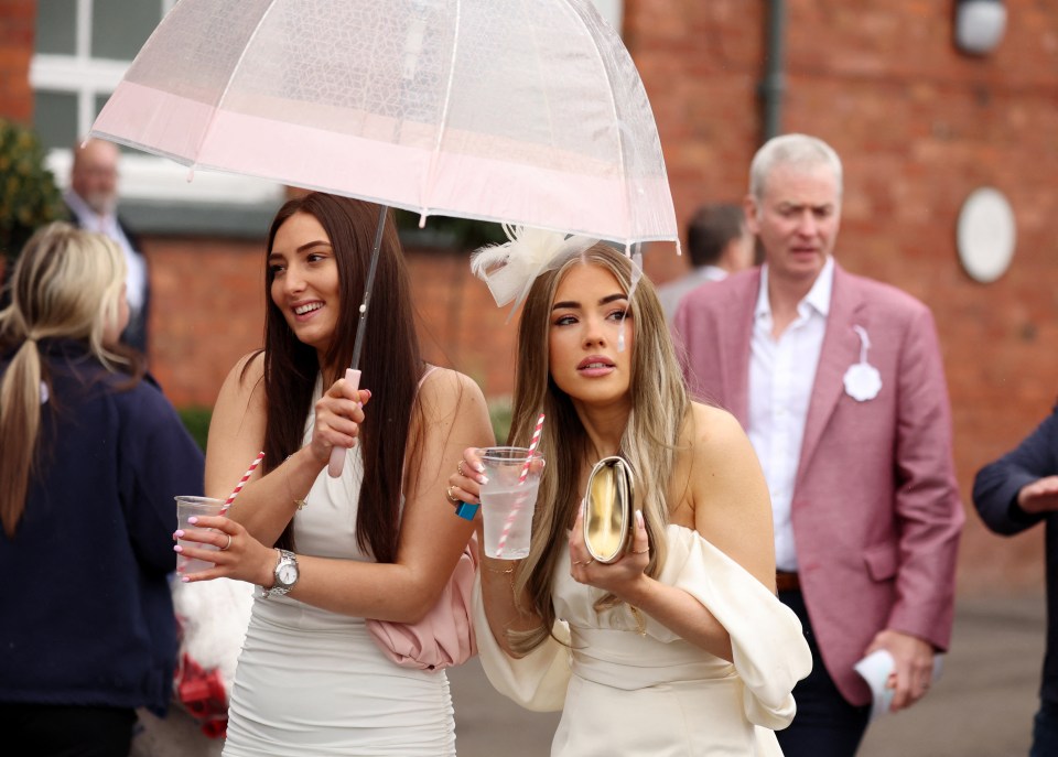 Guests seemed in high spirits as they enjoyed drinks under umbrellas