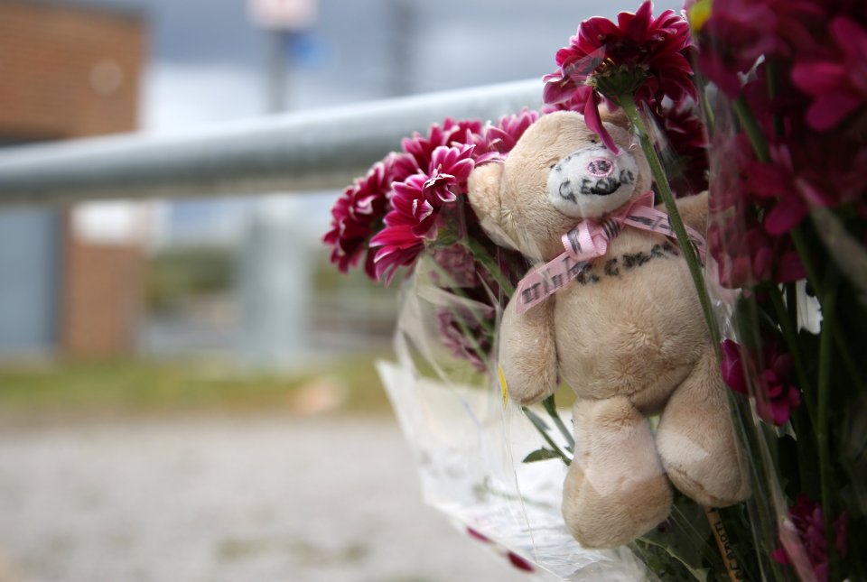 Flowers and teddies left by the water in Hunslet, Leeds