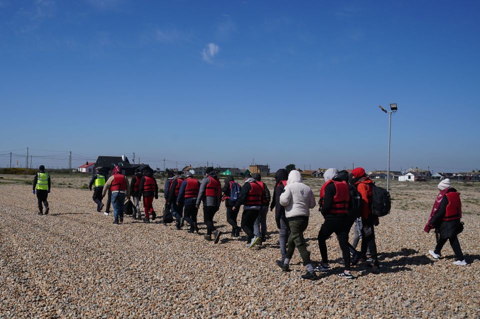 A group of people thought to be migrants are brought in to Dungeness, Kent, by the RNLI last week