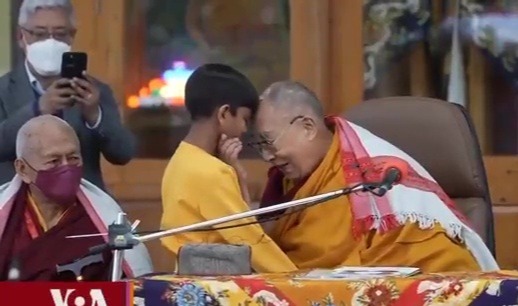 The Dalai Lama has come under fire for his behaviour with the young boy