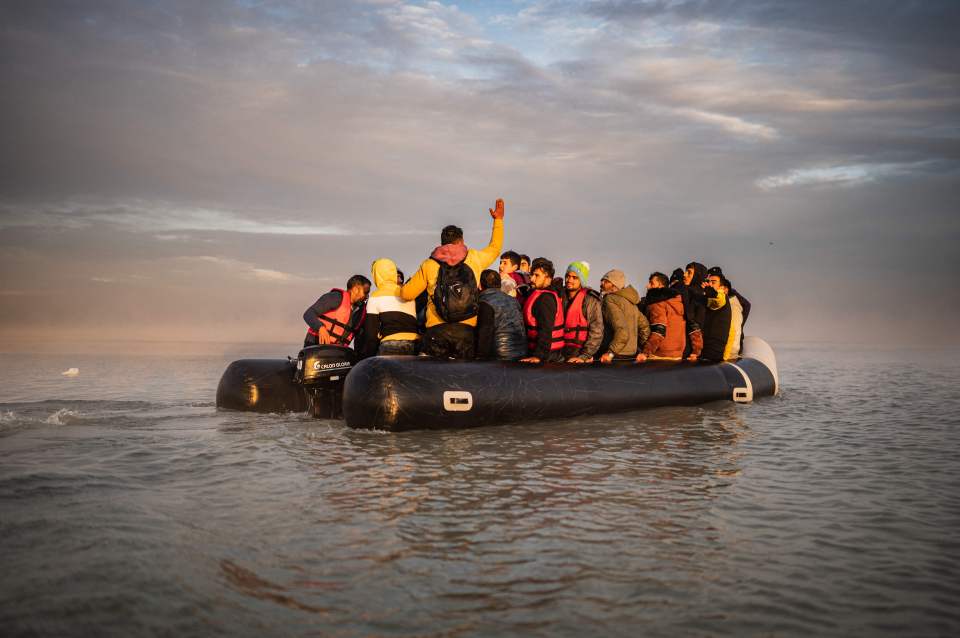 Migrants sail after boarding a smuggler’s boat on the beach of Gravelines, near Dunkirk, northern France