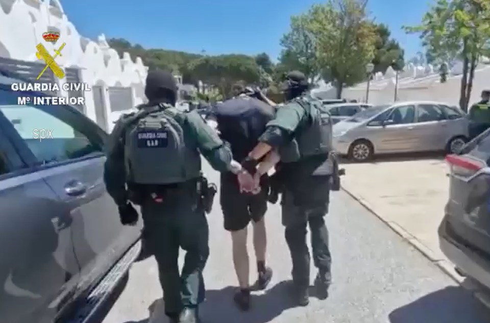 He was seen being led away in handcuffs