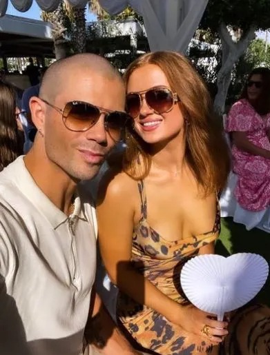 She is on holiday with boyfriend Max George