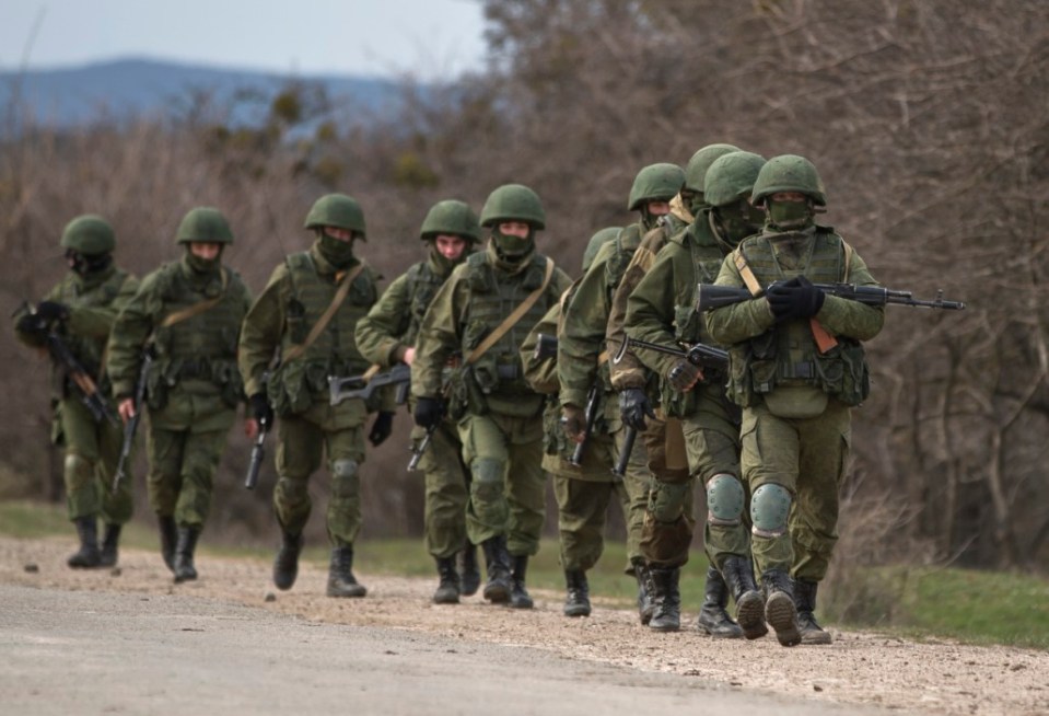 Russian paramilitary soldiers 'little green men' march in Crimea, 2014