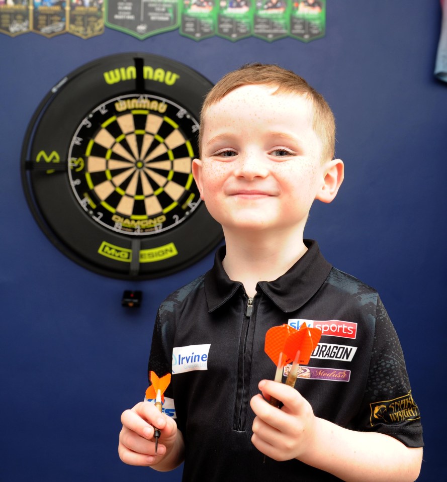 Lucas Maidment, five, became hooked on darts after watching his dad practising at home