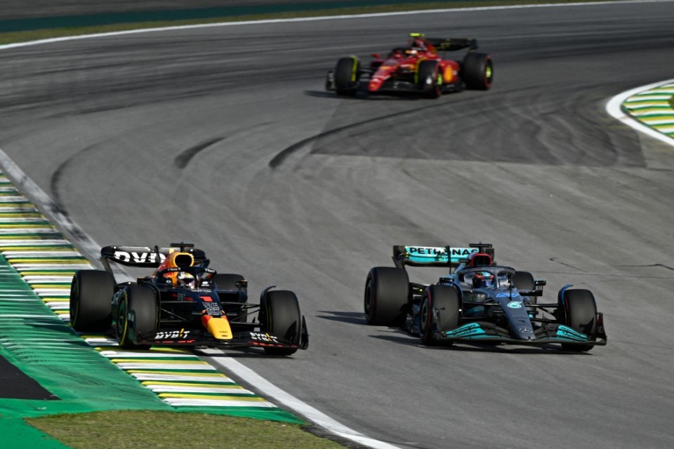 Red Bull Racing's driver Max Verstappen and Mercedes' driver George Russell at the 2022 Brazil Grand Prix.