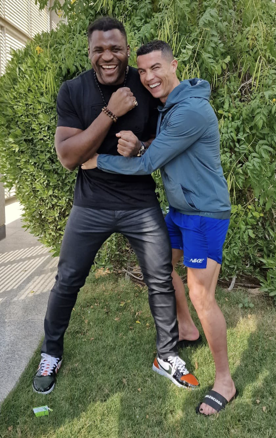 Ronaldo showed off his black painted toenails in a snap with Francis Ngannou