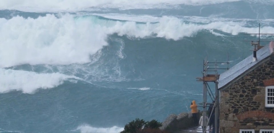 Huge waves are seen off the Cornish coast today at Cape Cornwall