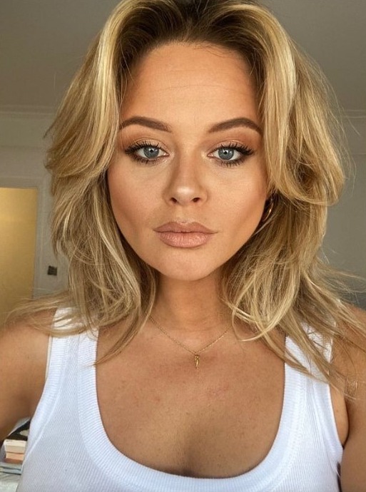 Emily Atack slipped into a skintight white vest as she enjoyed the sunshine