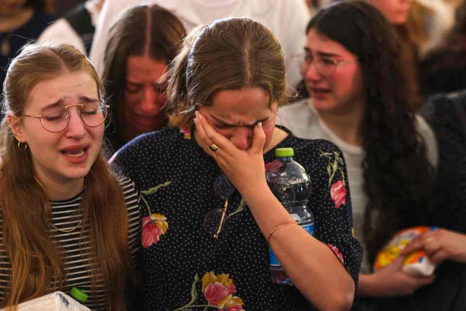 Rina's classmates mourned openly at her funeral