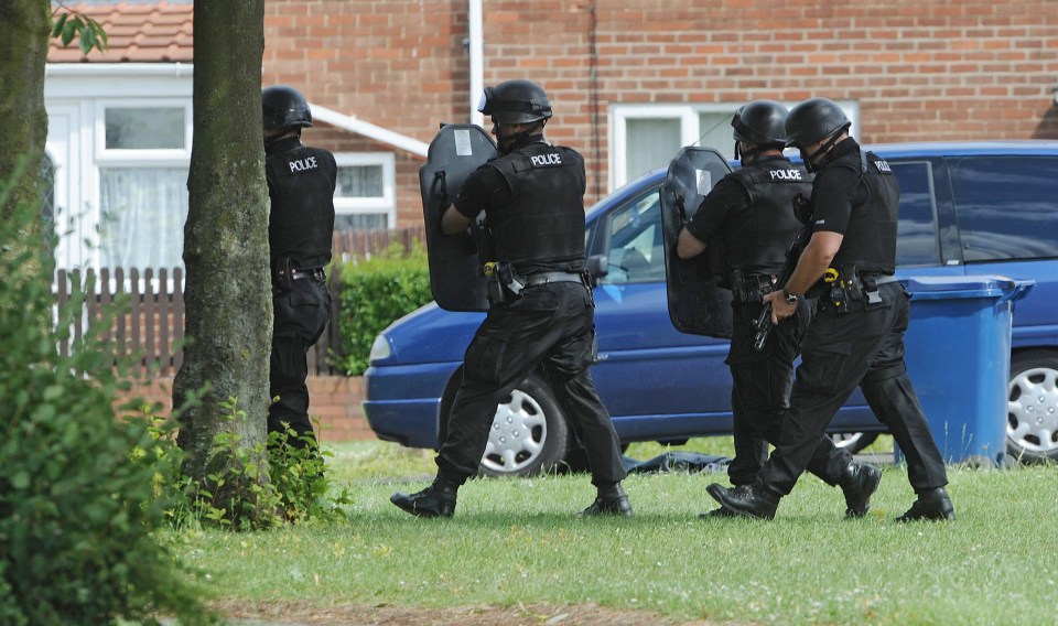 Armed police in the search for Moat in Juley 2010