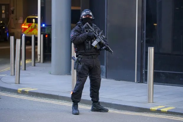 Armed officers stood guard as Cashman was taken to court in a prison van