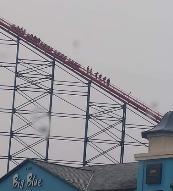 Riders being rescued after the Big One at Blackpool Pleasure Beach ground to a halt during high winds