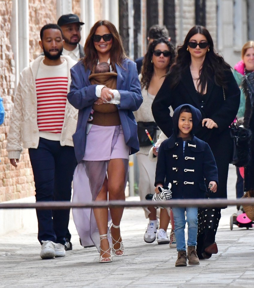 The couple were pictured in Venice with three-month-old Esti, sister Luna, seven, and their brother Miles, four