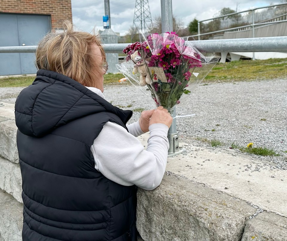 George’s grandmother Sam Buckham laying flowers at the scene