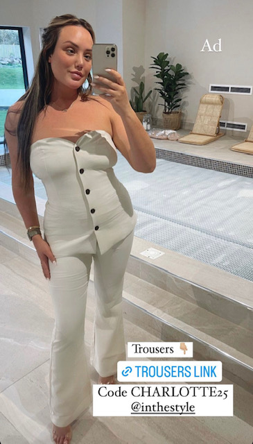 Charlotte posed in the all white outfit