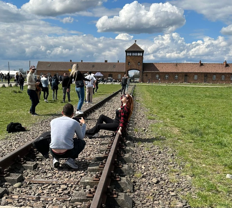 People on Twitter were horrified by the images which showed a woman draped over the track at the Nazi death camp