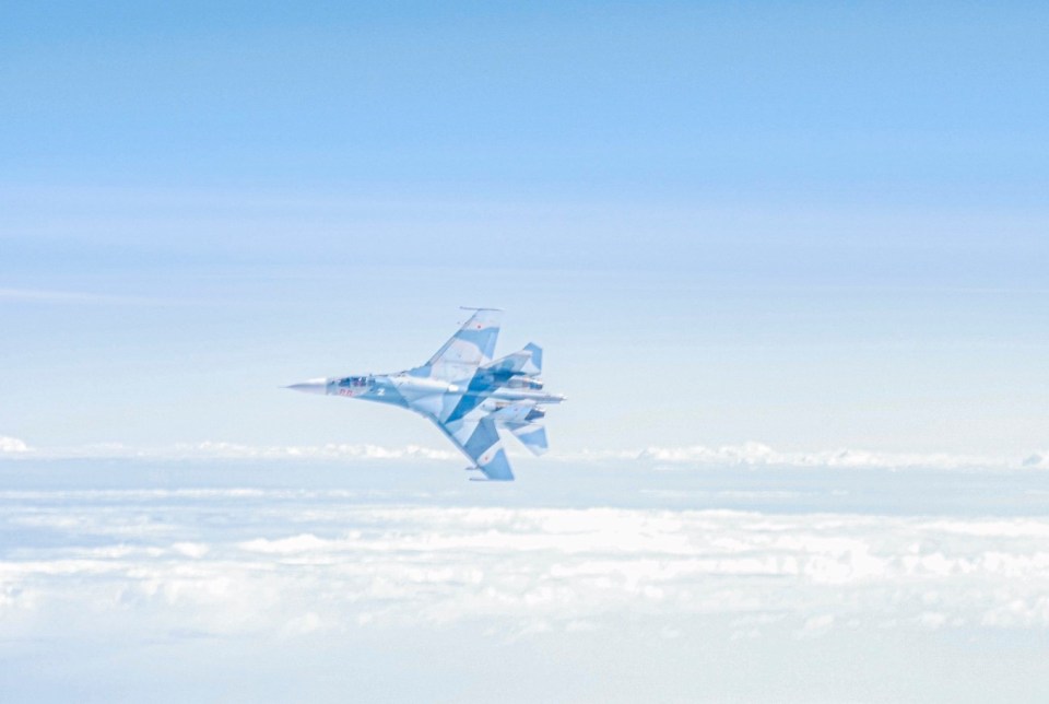 One of the Russian jets banking in front of the British and German planes