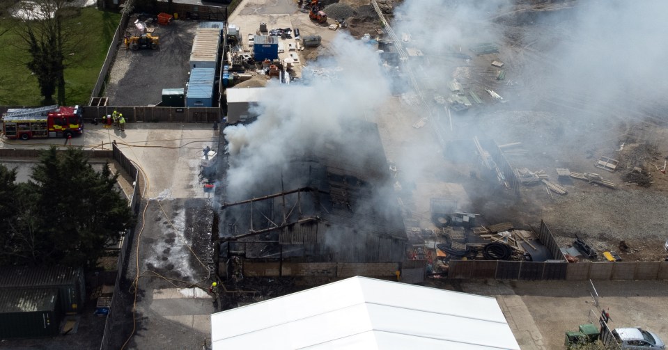 Workers were stood outside watching firefighters battle the inferno