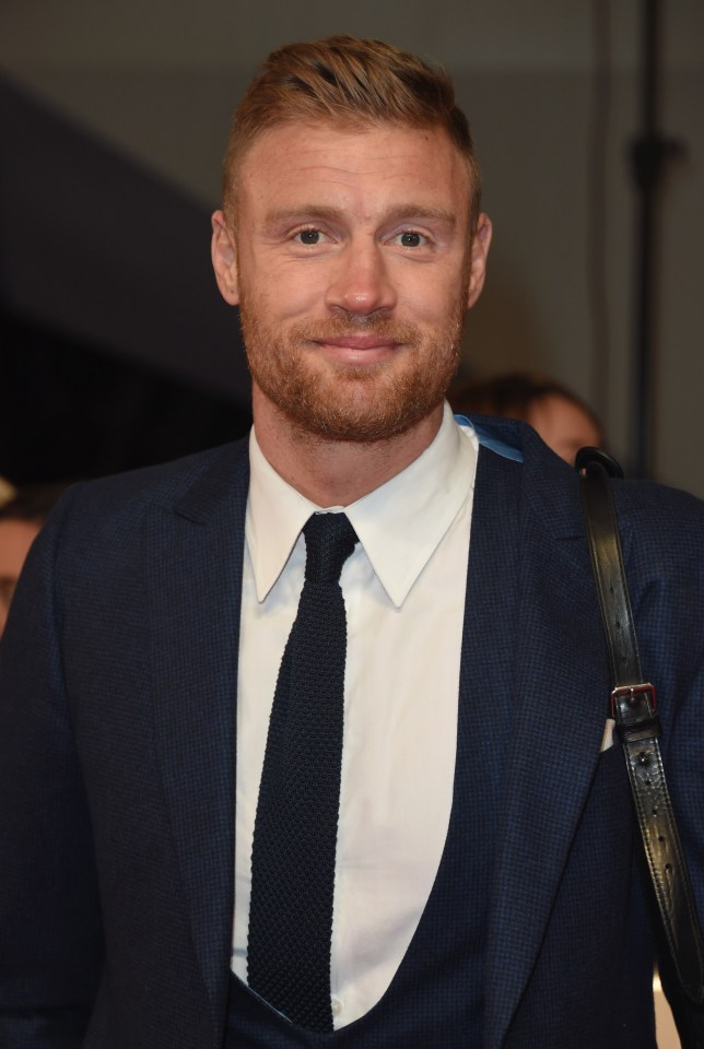 a man with a beard is wearing a suit and tie