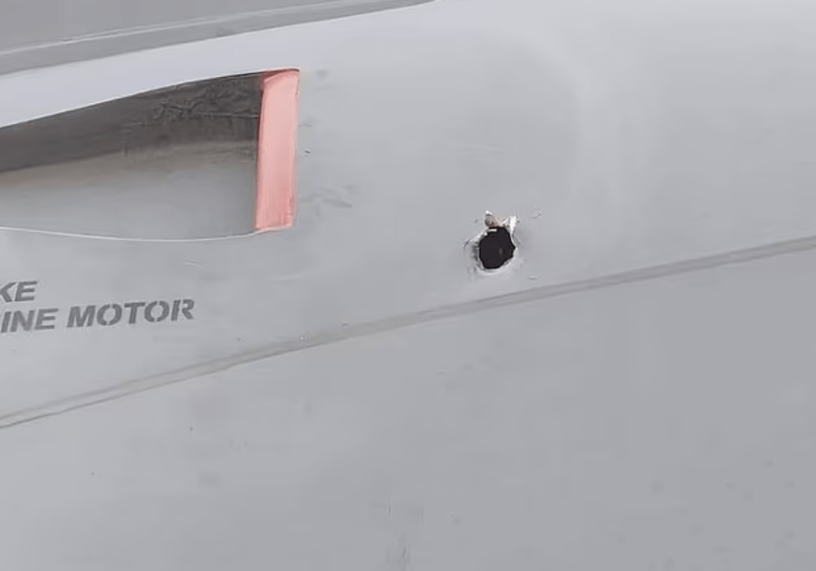 Bullet holes are visible on the evacuation plane