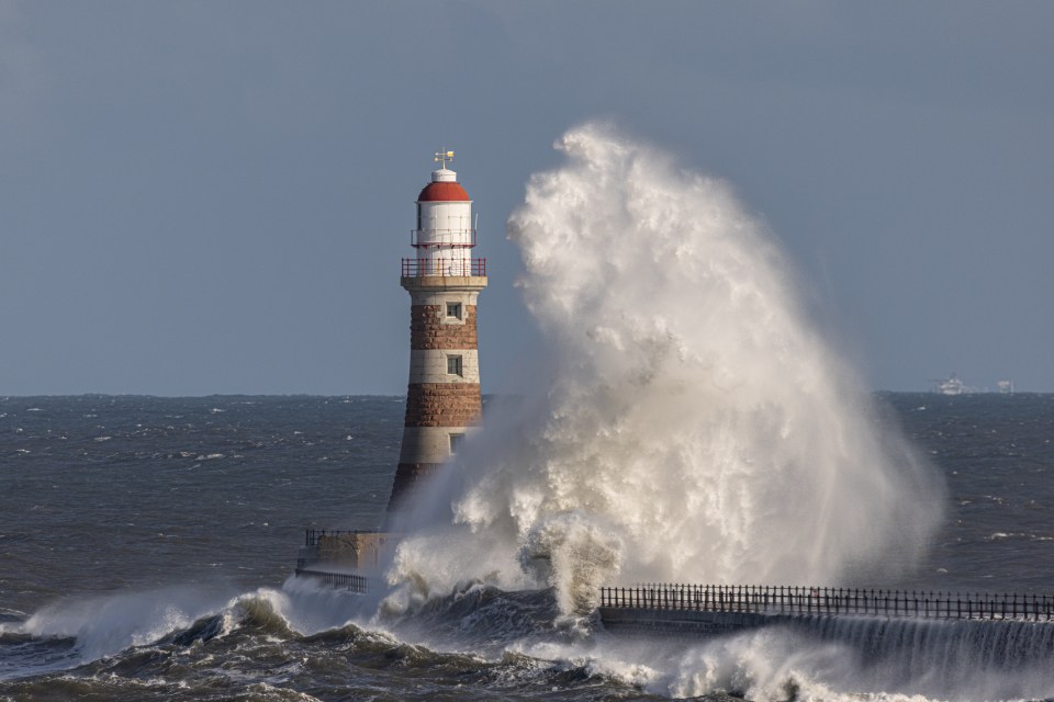 Huge waves dwarf a lighthouse near Sunderland