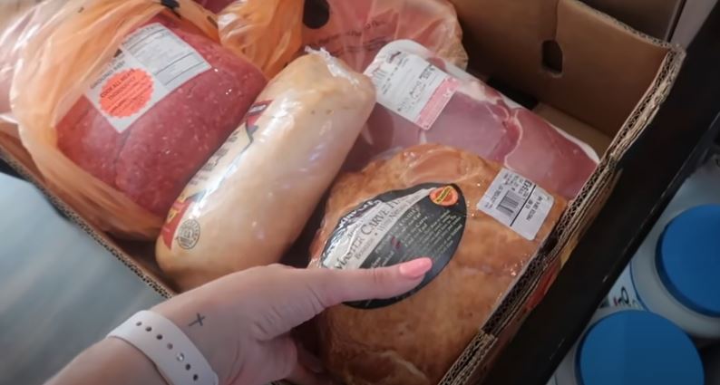 The savvy shopper bought two whole chickens, 12 packs full of chicken breasts, 24 massive Italian sausages, 18 pork chops, carved hack, turkey breast and ground beef