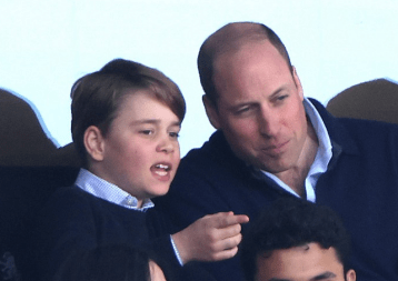 Prince George pointing towards the pitch during the Premier League clash