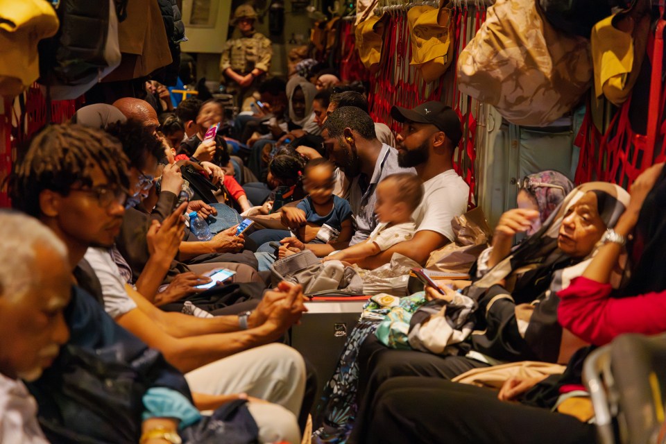 Brits on board an RAF aircraft after being evacuated from Sudan