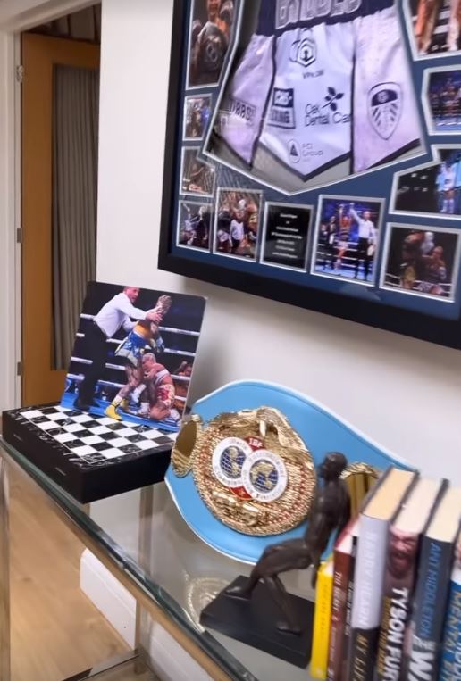 Ebanie’s boxing belts and memorabilia is visible on her walls