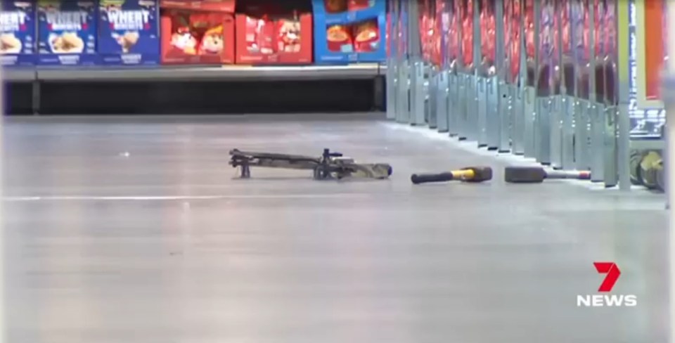 A bow and two hammers seen on the supermarket floor after the horror attack