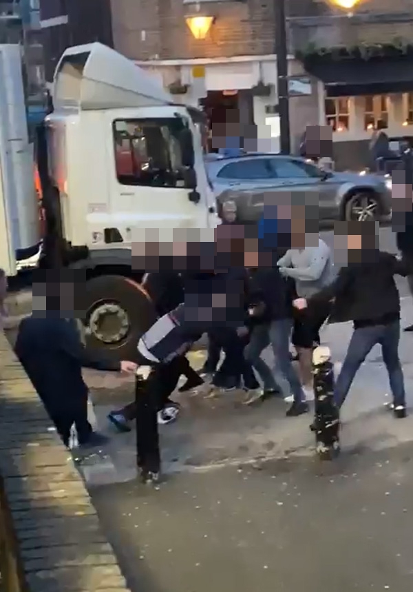 The group of football fans started brawling outside Euston