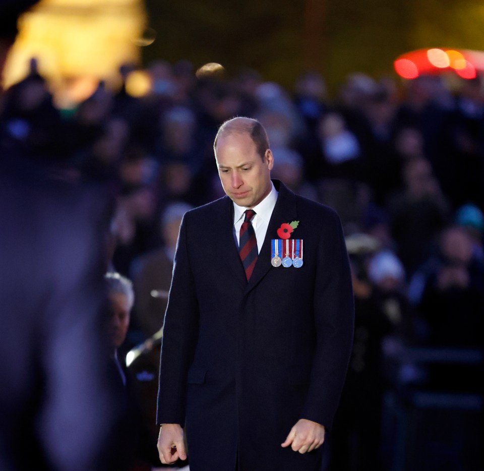 He wore a red poppy during the service, and bowed briefly to the wreath before standing in silent tribute for a few moments