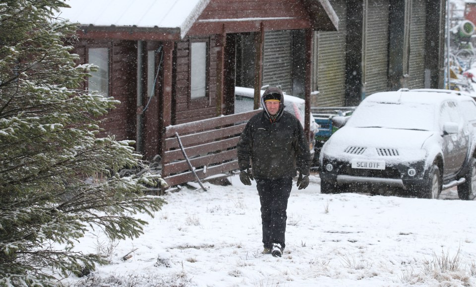 Neil Robb trudges through the snow today near Corgarff in the North of Scotland